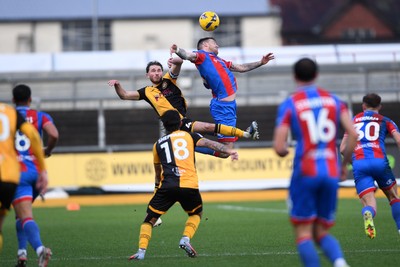 070226 - Newport County v Grimsby Town - Sky Bet League 2 - Matthew Baker of Newport County heads the ball