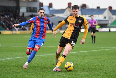 070226 - Newport County v Grimsby Town - Sky Bet League 2 - Ged Garner of Newport County is challenged by Jaze Kabia of Grimsby