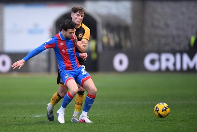 070226 - Newport County v Grimsby Town - Sky Bet League 2 - Tom Davies of Newport County is challenged by Tyrell Warren of Grimsby