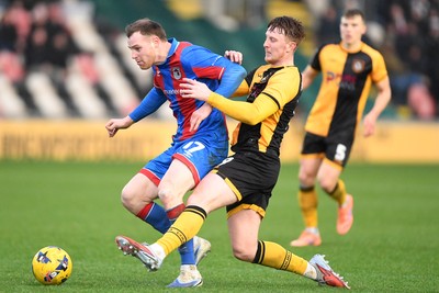 070226 - Newport County v Grimsby Town - Sky Bet League 2 - Ged Garner of Newport County is challenged by Cameron McJannet of Grimsby