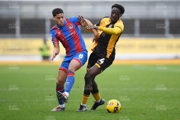 070226 - Newport County v Grimsby Town - Sky Bet League 2 - Nathan Opoku of Newport County is challenged by Evan Khouri of Grimsby