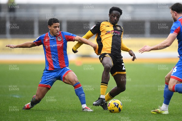 070226 - Newport County v Grimsby Town - Sky Bet League 2 - Nathan Opoku of Newport County is challenged by Evan Khouri of Grimsby
