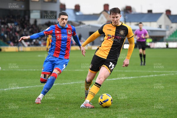070226 - Newport County v Grimsby Town - Sky Bet League 2 - Ged Garner of Newport County is challenged by Jaze Kabia of Grimsby