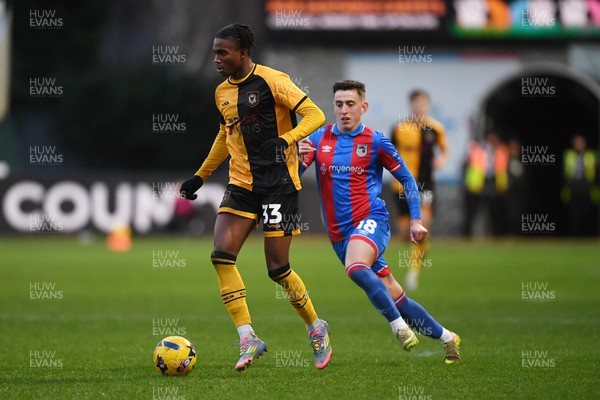 070226 - Newport County v Grimsby Town - Sky Bet League 2 - Tanatswa Nyakuhwa of Newport County is challenged by Darragh Burns of Grimsby