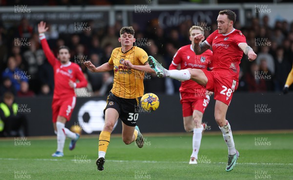 161223 - Newport County v Grimsby Town, EFL Sky Bet League 2 - Toby Mullarkey of Grimsby clears as Seb Palmer-Houlden of Newport County races through onto the ball