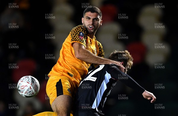 201119 - Newport County v Grimsby Town - FA Cup - Ryan Inniss of Newport County and Elliott Hewitt of Grimsby Town compete