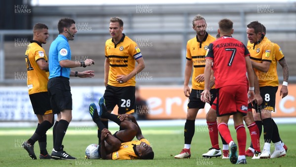 250818 - Newport County v Grimsby Town - SkyBet League 2 - Tyreeq Bakinson of Newport County goes down after a tackle