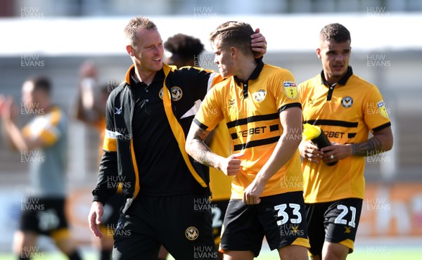 250818 - Newport County v Grimsby Town - SkyBet League 2 - Newport County manager Michael Flynn and Charlie Cooper of Newport County at the end of the game
