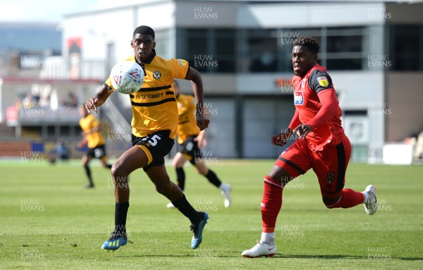 250818 - Newport County v Grimsby Town - SkyBet League 2 - Tyreeq Bakinson of Newport County gets away from Mitch Rose of Grimsby Town