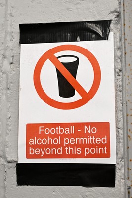 260926 - Newport County v Grimsby Town - Sky Bet League 2 - A no alcohol sign under the stands of Rodney Parade after Andy Burnham, Prime Minister claims he may lift a ban on Alcohol in Football stands