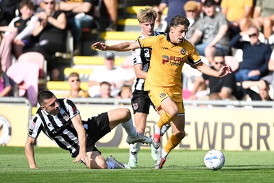 260926 - Newport County v Grimsby Town - Sky Bet League 2 - Harrison Biggins of Newport County is challenged by Sam Lavelle of Grimsby