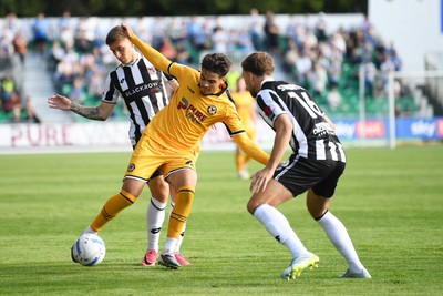 260926 - Newport County v Grimsby Town - Sky Bet League 2 - Matt Dibley-Dias of Newport County is challenged by Reece Staunton of Grimsby