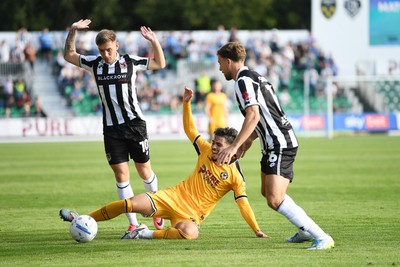 260926 - Newport County v Grimsby Town - Sky Bet League 2 - Matt Dibley-Dias of Newport County is challenged by Reece Staunton of Grimsby