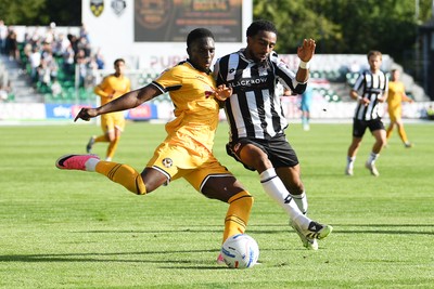 260926 - Newport County v Grimsby Town - Sky Bet League 2 - Michael Adu-Poku of Newport County is challenged by Jayden Sweeney of Grimsby