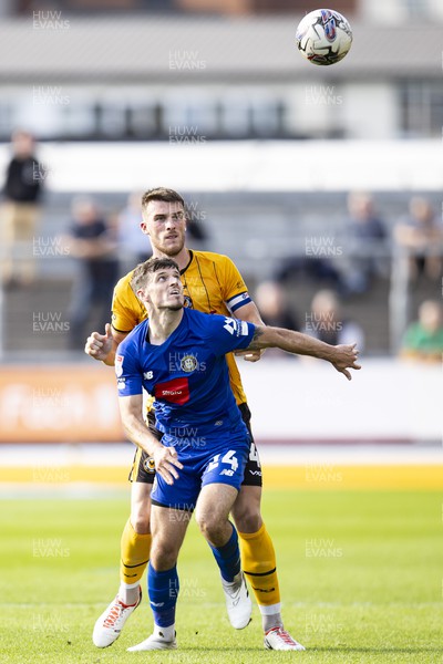 071023 - Newport County v Harrogate Town - Sky Bet League 2 - Ryan Delaney of Newport County in action against Josh March of Harrogate Town