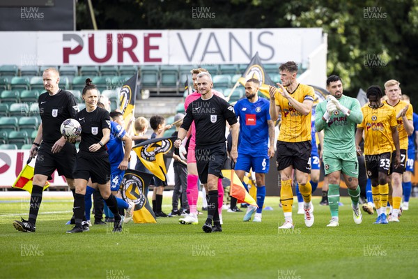 071023 - Newport County v Harrogate Town - Sky Bet League 2 - Referee Rebecca Welch leads the sides out ahead of kick off