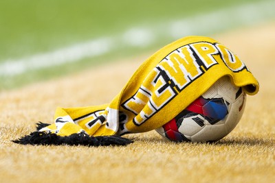 110426 - Newport County v Harrogate Town - Sky Bet League 2 - Newport County scarf on a match ball ahead of kick off