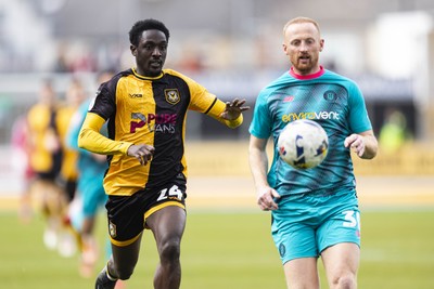 110426 - Newport County v Harrogate Town - Sky Bet League 2 - Nathan Opoku of Newport County in action against Liam Gibson of Harrogate Town