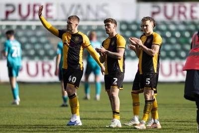 110426 - Newport County v Harrogate Town - Sky Bet League 2 - Cole Jarvis, Cameron Evans & Sven Sprangler of Newport County applaud the fans at full time