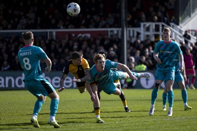 110426 - Newport County v Harrogate Town - Sky Bet League 2 - James Crole of Newport County in action against Bobby Faulkner of Harrogate Town