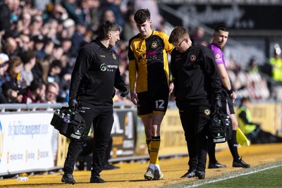 110426 - Newport County v Harrogate Town - Sky Bet League 2 - Joe Thomas of Newport County is substituted after injury
