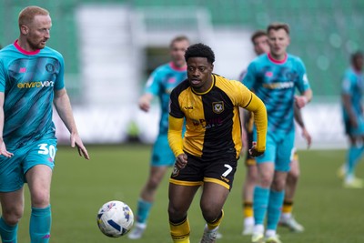 110426 - Newport County v Harrogate Town - Sky Bet League 2 - Bobby Kamwa of Newport County in action against Liam Gibson of Harrogate Town