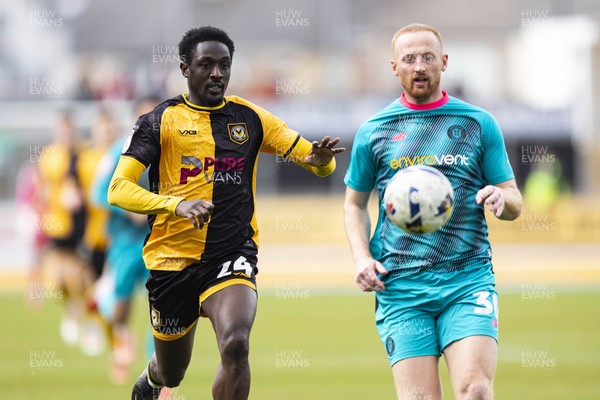 110426 - Newport County v Harrogate Town - Sky Bet League 2 - Nathan Opoku of Newport County in action against Liam Gibson of Harrogate Town