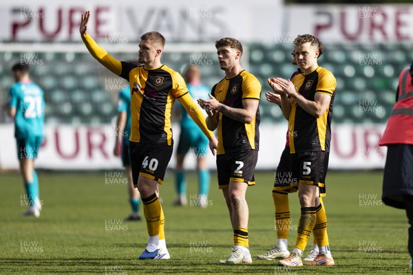 110426 - Newport County v Harrogate Town - Sky Bet League 2 - Cole Jarvis, Cameron Evans & Sven Sprangler of Newport County applaud the fans at full time