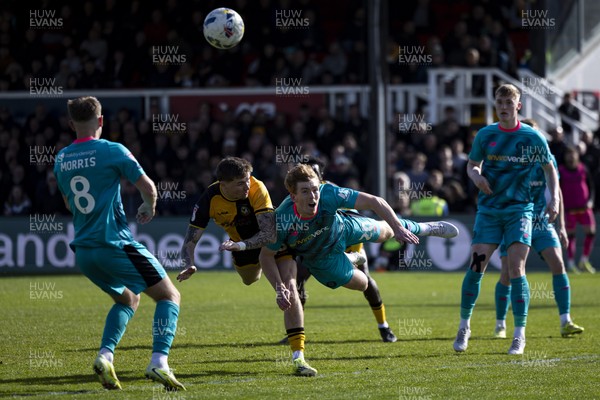 110426 - Newport County v Harrogate Town - Sky Bet League 2 - James Crole of Newport County in action against Bobby Faulkner of Harrogate Town