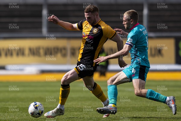110426 - Newport County v Harrogate Town - Sky Bet League 2 - Lee Jenkins of Newport County in action against Bryn Morris of Harrogate Town