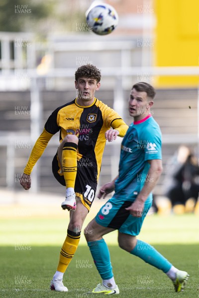 110426 - Newport County v Harrogate Town - Sky Bet League 2 - Harrison Biggins of Newport County in action against Bryn Morris of Harrogate Town