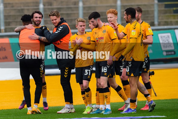150122 - Newport County v Harrogate Town - Sky Bet League 2 - Dom Telford of Newport County celebrates his goal with the subs as Finn Azaz of Newport County is congratulated on the assist
