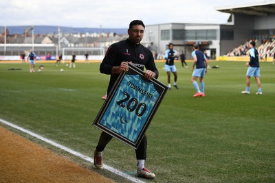 150325 - Newport County v Harrogate Town - Sky Bet League 2 - Nick Townsend of Newport County is presented a jersey by Newport Head Coach, Nelson Jardim for his 200th appearance