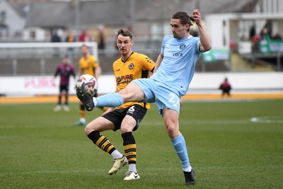 150325 - Newport County v Harrogate Town - Sky Bet League 2 - Ciaran Brennan of Newport County is challenged by Ben Fox of Harrogate Town