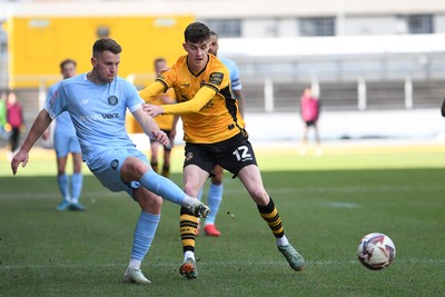 150325 - Newport County v Harrogate Town - Sky Bet League 2 - Joe Thomas of Newport County is challenged by Bryn Morris of Harrogate Town