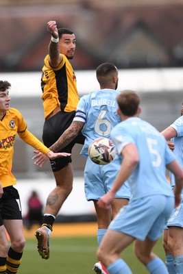 150325 - Newport County v Harrogate Town - Sky Bet League 2 - Courtney Baker-Richardson of Newport County is challenged by Warren Burrell of Harrogate Town