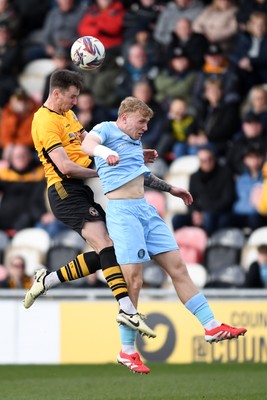 150325 - Newport County v Harrogate Town - Sky Bet League 2 - Ciaran Brennan of Newport County is challenged by Dean Cornelius of Harrogate Town