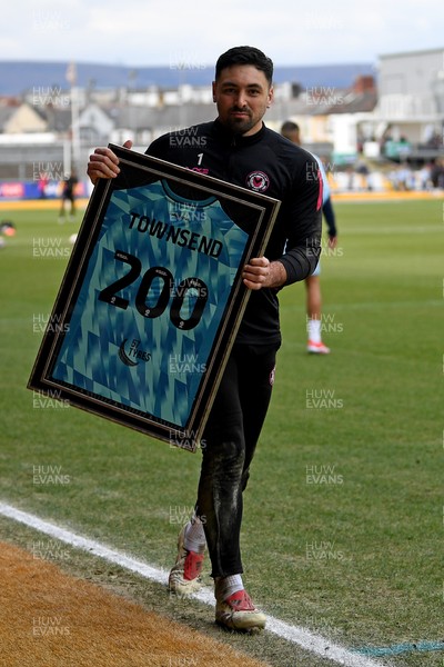 150325 - Newport County v Harrogate Town - Sky Bet League 2 - Nick Townsend of Newport County is presented a jersey by Newport Head Coach, Nelson Jardim for his 200th appearance