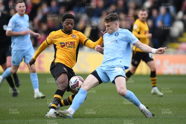 150325 - Newport County v Harrogate Town - Sky Bet League 2 - Bobby Kamwa of Newport County is challenged by Toby Sims of Harrogate Town