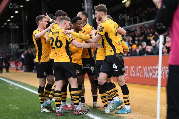 150325 - Newport County v Harrogate Town - Sky Bet League 2 - James Clarke of Newport County celebrates scoring a goal with team mates