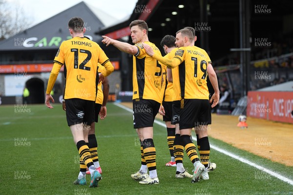 150325 - Newport County v Harrogate Town - Sky Bet League 2 - James Clarke of Newport County celebrates scoring a goal with team mates