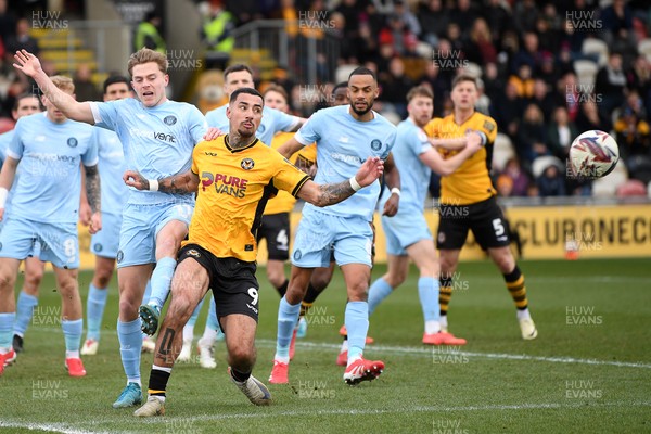 150325 - Newport County v Harrogate Town - Sky Bet League 2 - Courtney Baker-Richardson of Newport County is held off by James Daly of Harrogate Town