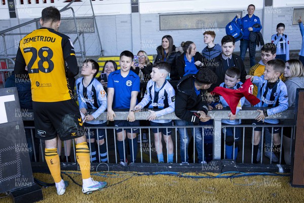 150423 - Newport County v Hartlepool United - Sky Bet League 2 - Mickey Demetriou of Newport County signs autographs for fans at full time