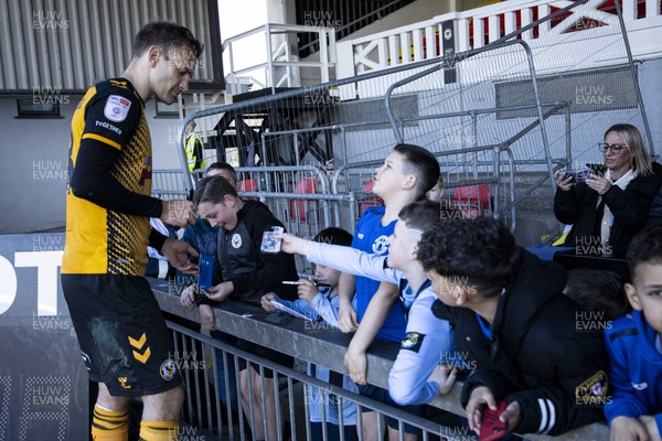 150423 - Newport County v Hartlepool United - Sky Bet League 2 - Mickey Demetriou of Newport County signs autographs for fans at full time