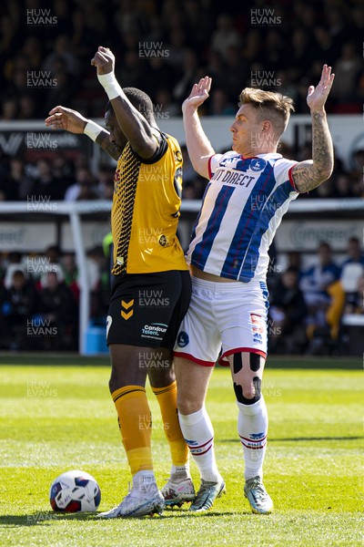 150423 - Newport County v Hartlepool United - Sky Bet League 2 - Omar Bogle of Newport County in action against Euan Murray of Hartlepool United
