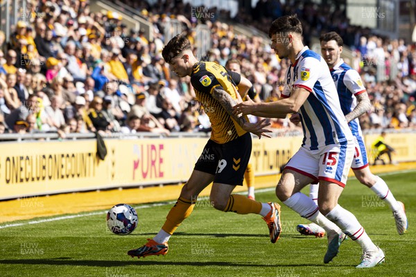150423 - Newport County v Hartlepool United - Sky Bet League 2 - Charlie McNeill of Newport County in action against Edon Pruti of Hartlepool United