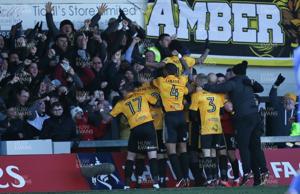 070118 - Newport County v Leeds United, Emirates FA Cup Round 3 - Shawn McCoulsky of Newport County celebrates infant of the fans after scoring the winning goal