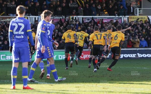 070118 - Newport County v Leeds United, Emirates FA Cup Round 3 - Shawn McCoulsky of Newport County wheels away with team mates to celebrate after scoring the winning goal