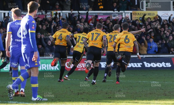 070118 - Newport County v Leeds United, Emirates FA Cup Round 3 - Shawn McCoulsky of Newport County wheels away with team mates to celebrate after scoring the winning goal