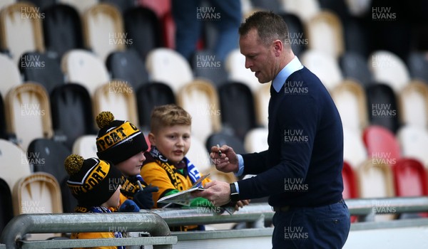 060119 - Newport County v Leicester City - FA Cup 3rd Round - Newport County Manager Michael Flynn signs kids programmes before the game